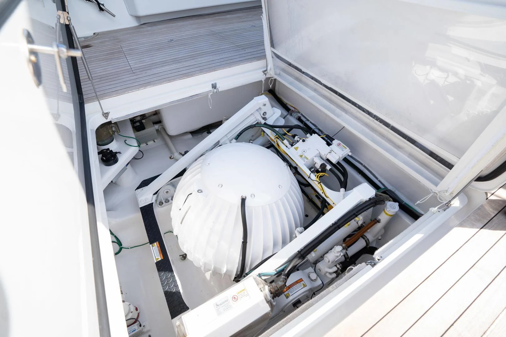 a white machine with a metal frame aboard MER SEA SAKES Yacht for Sale