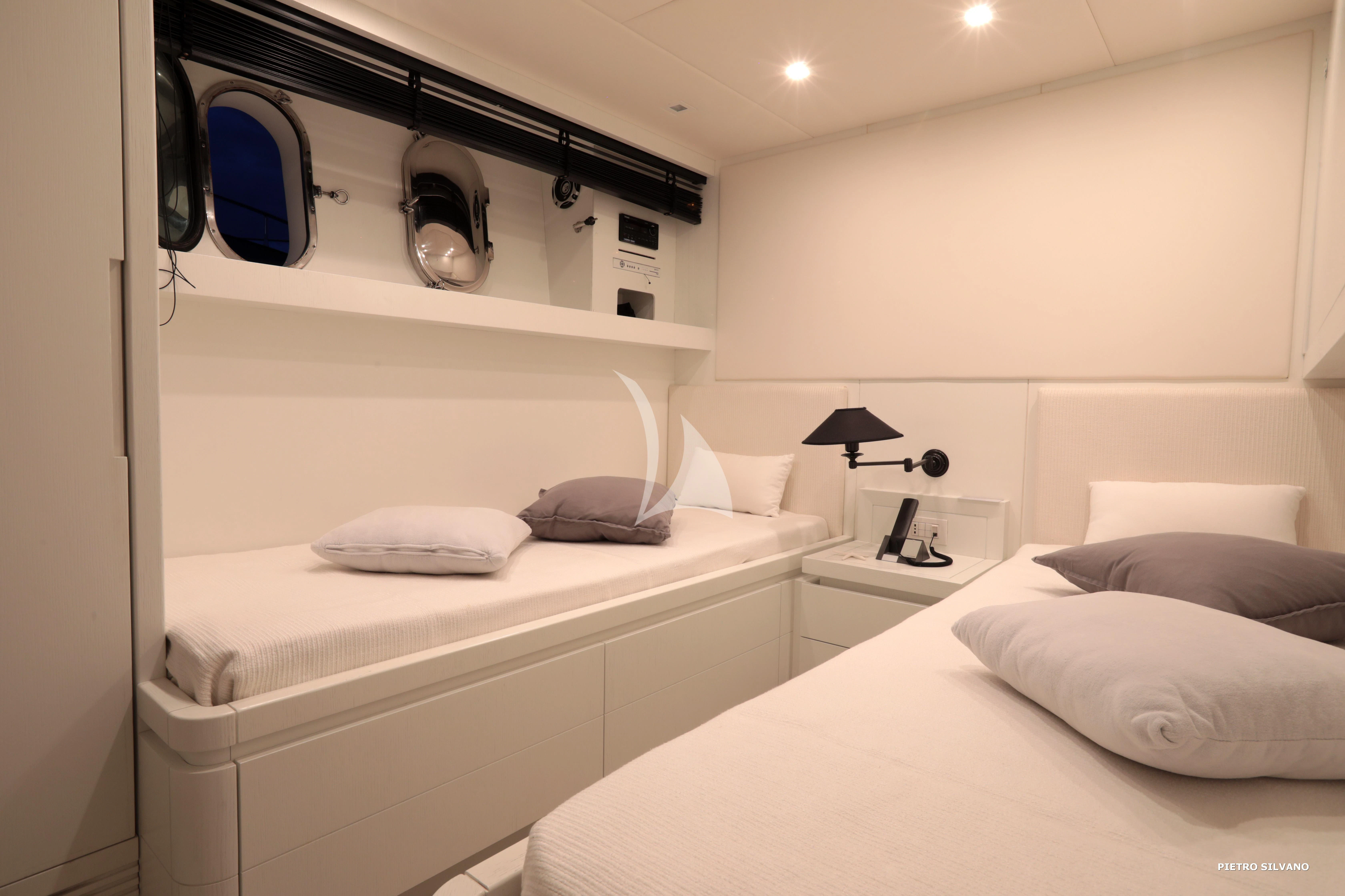 a room with a bed and a desk aboard NIKCA Yacht for Sale