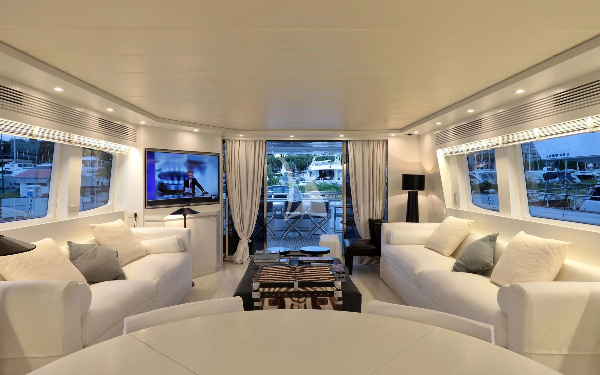 a living room with a large screen aboard NIKCA Yacht for Sale