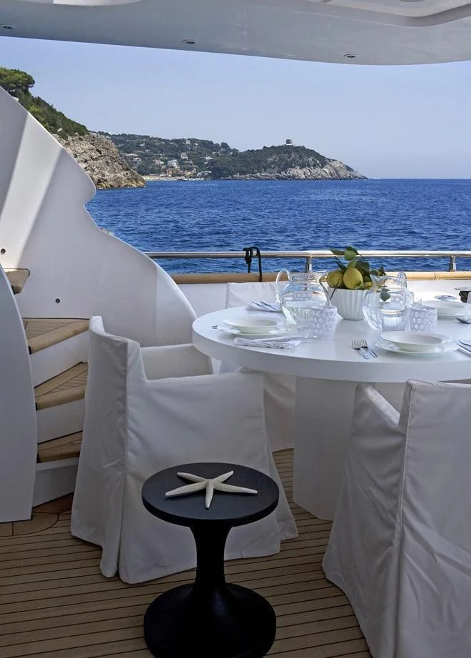 a table set for a dinner aboard NIKCA Yacht for Sale