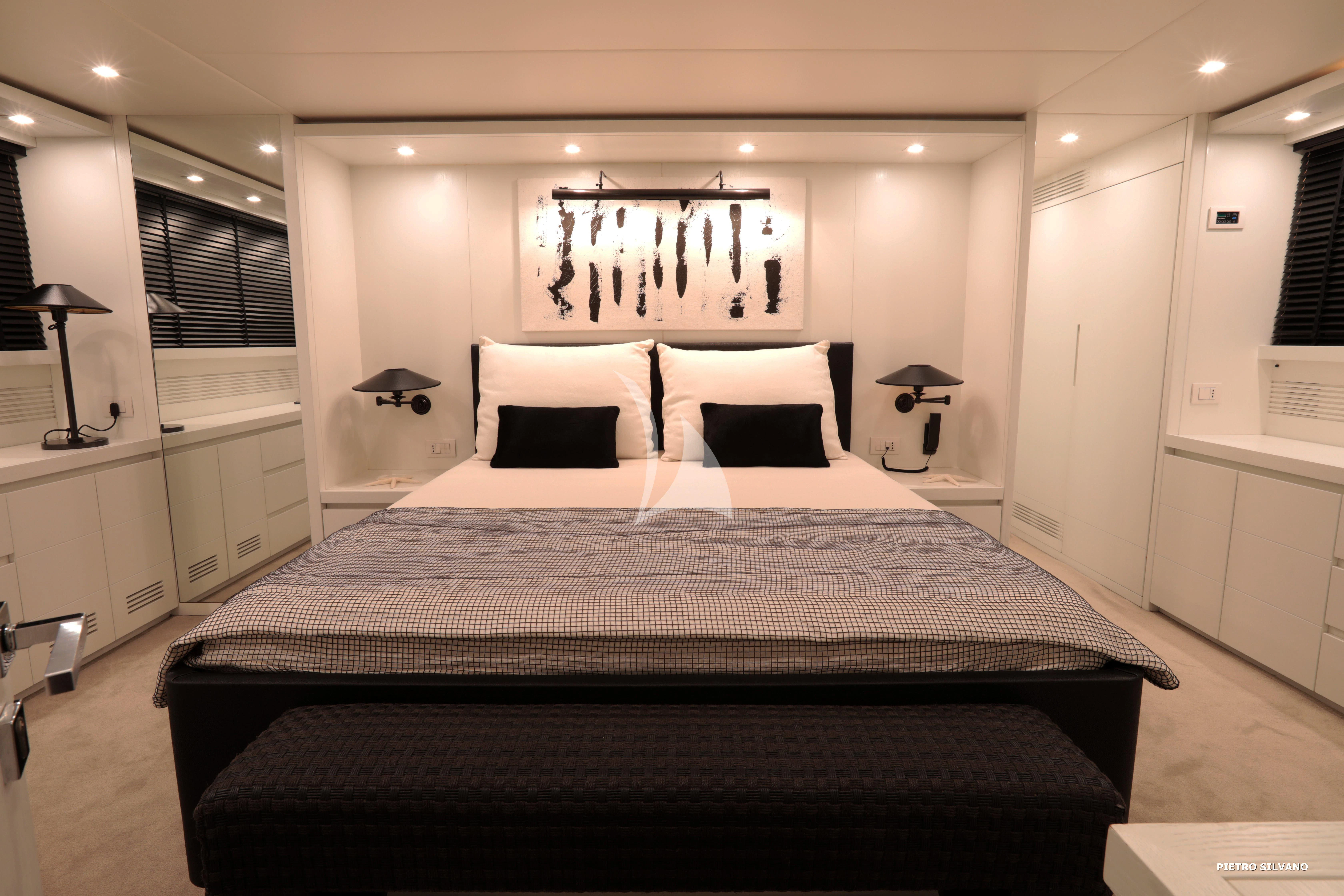 a large bed in a room aboard NIKCA Yacht for Sale