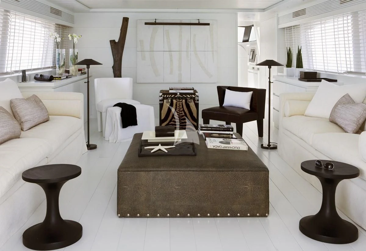 a living room with a fireplace aboard NIKCA Yacht for Sale