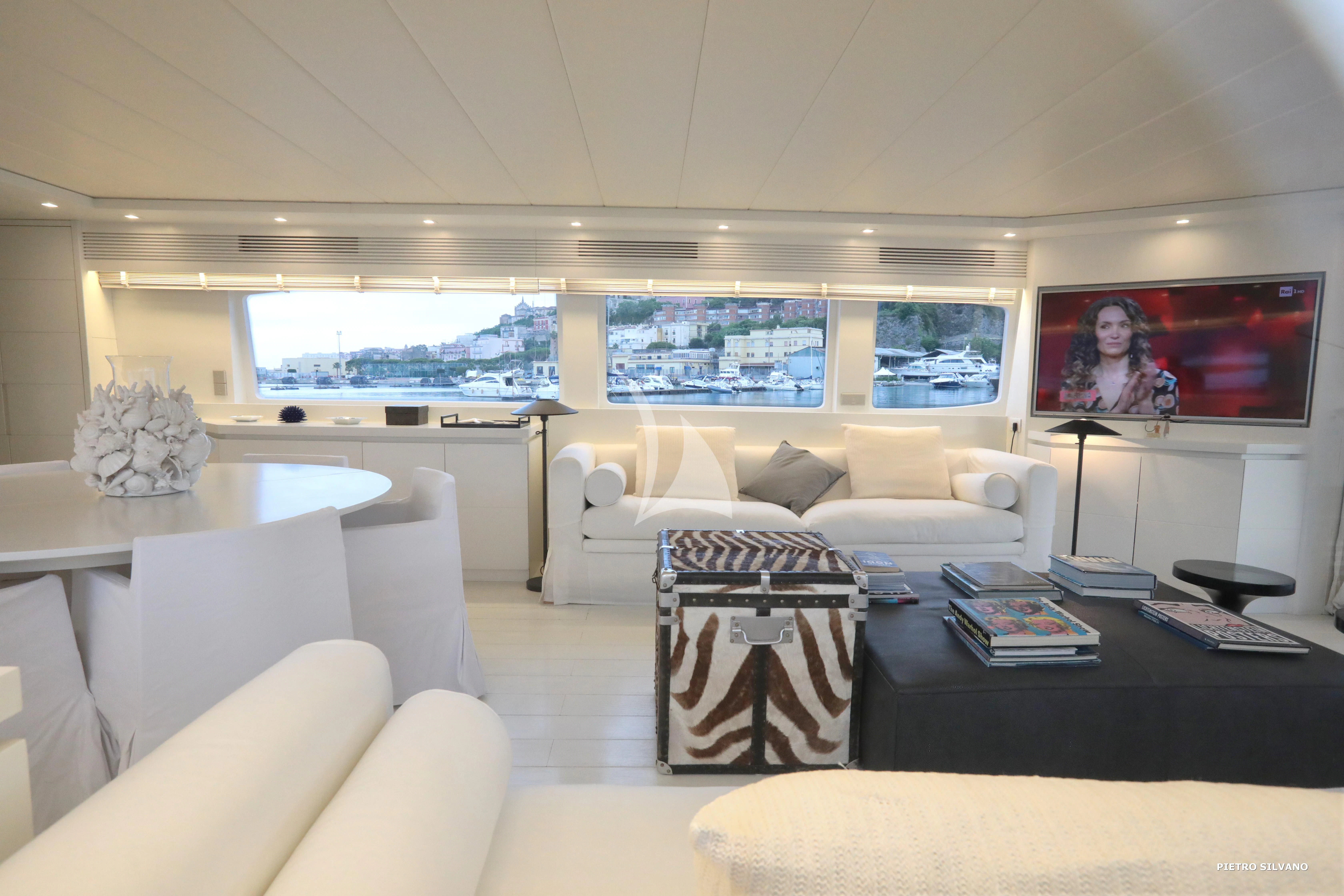 a living room with a large window aboard NIKCA Yacht for Sale