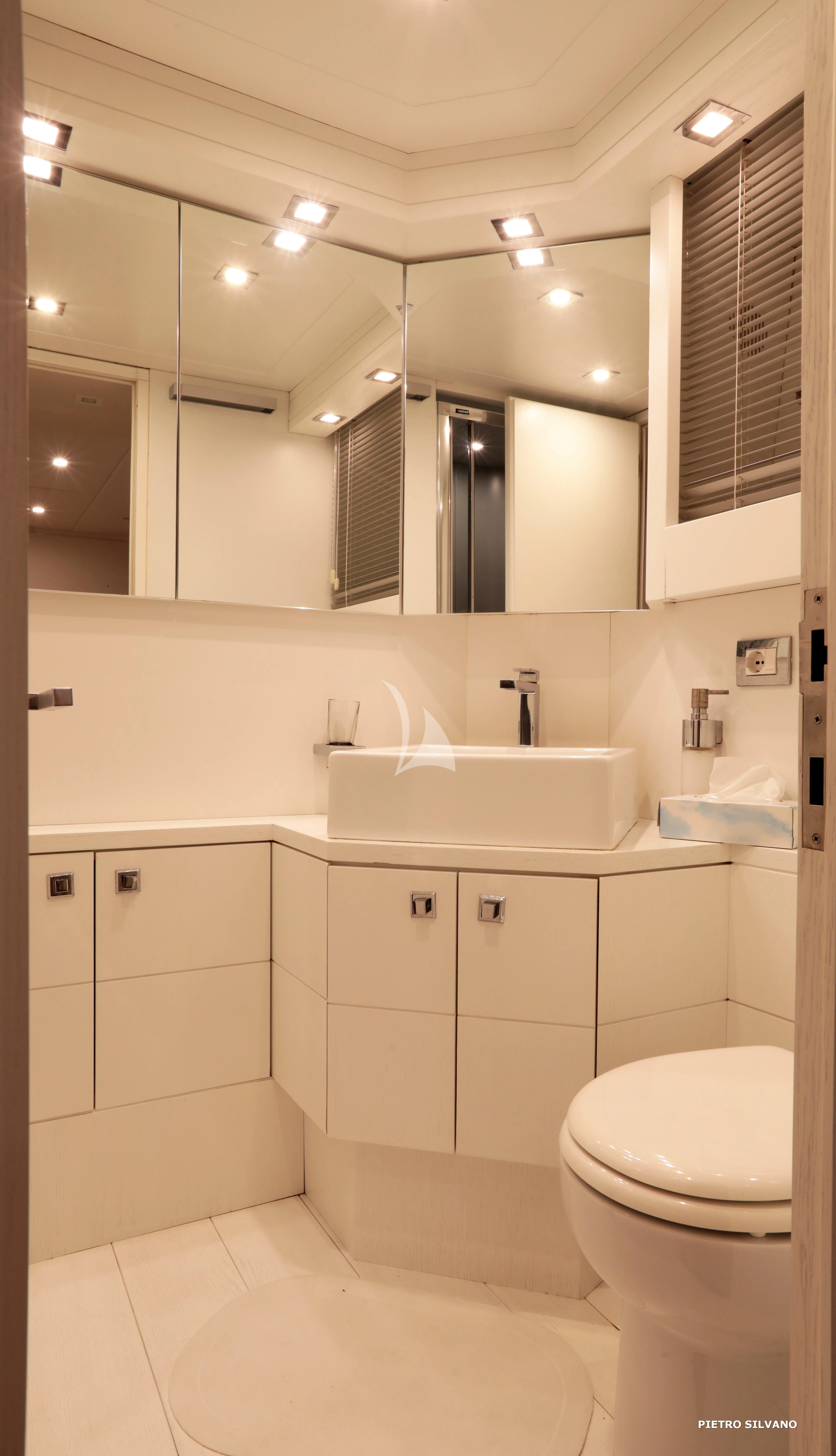 a bathroom with a sink and toilet aboard NIKCA Yacht for Sale