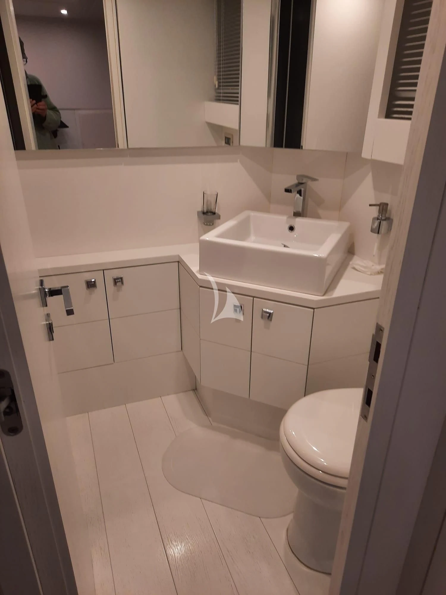 a bathroom with a sink and toilet aboard NIKCA Yacht for Sale