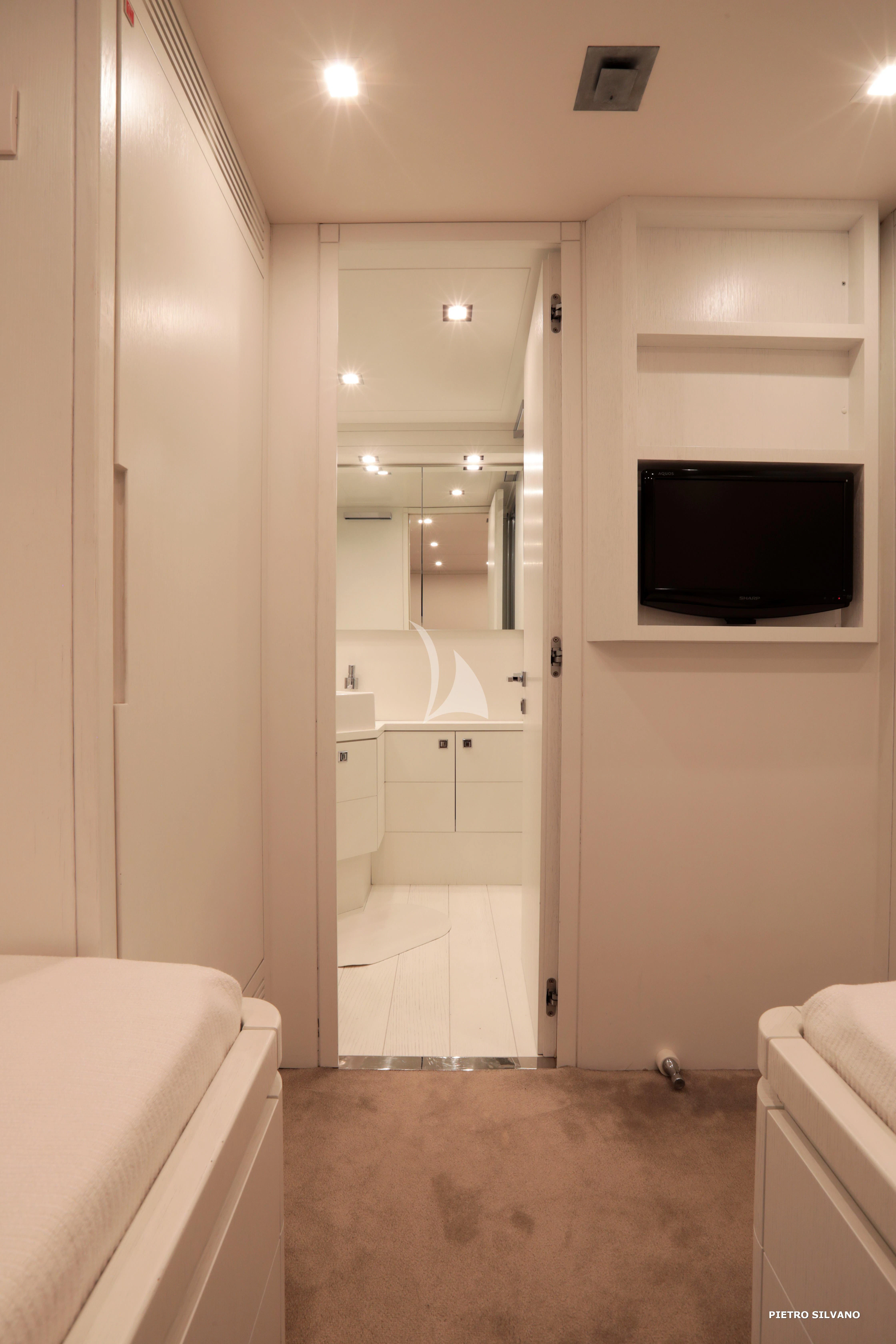 a bathroom with a large mirror aboard NIKCA Yacht for Sale