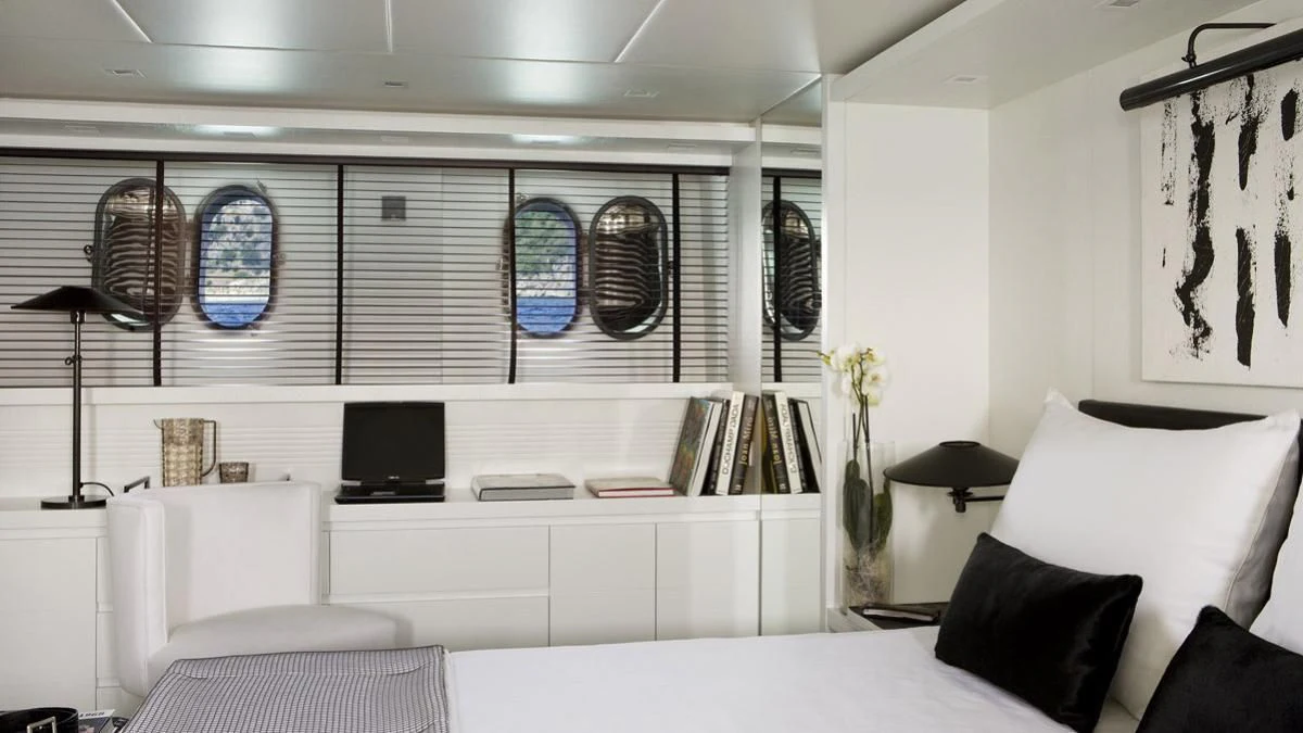 a room with white furniture aboard NIKCA Yacht for Sale