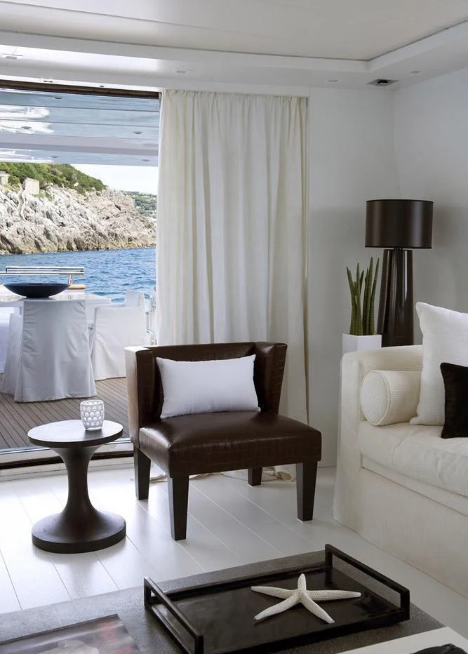 a living room with a large window aboard NIKCA Yacht for Sale