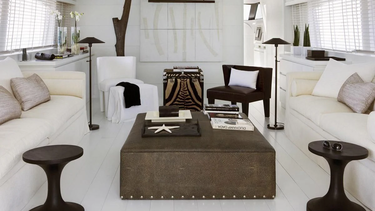 a living room with a couch and a coffee table aboard NIKCA Yacht for Sale