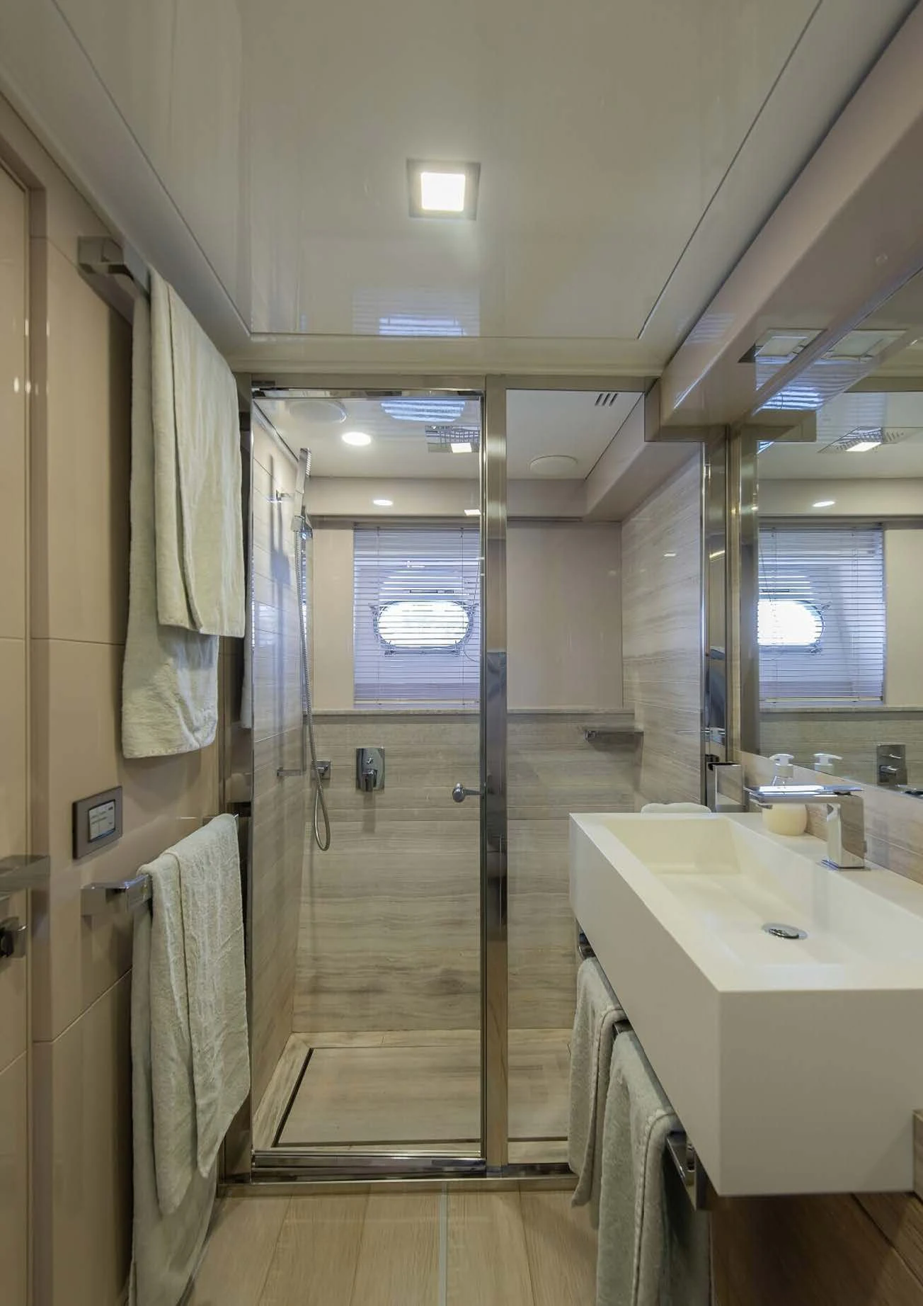 a bathroom with a glass shower aboard DALOLI Yacht for Charter