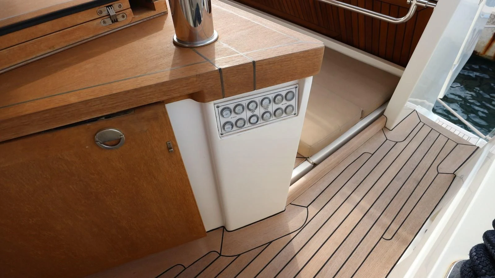a white microwave on a wooden counter aboard DALOLI Yacht for Charter