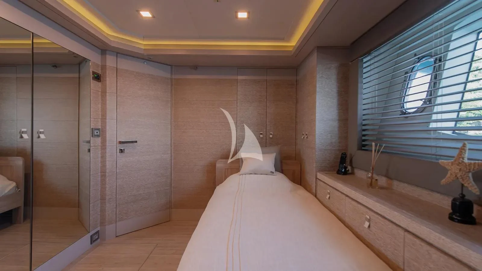 a room with a bed and a desk aboard DALOLI Yacht for Charter