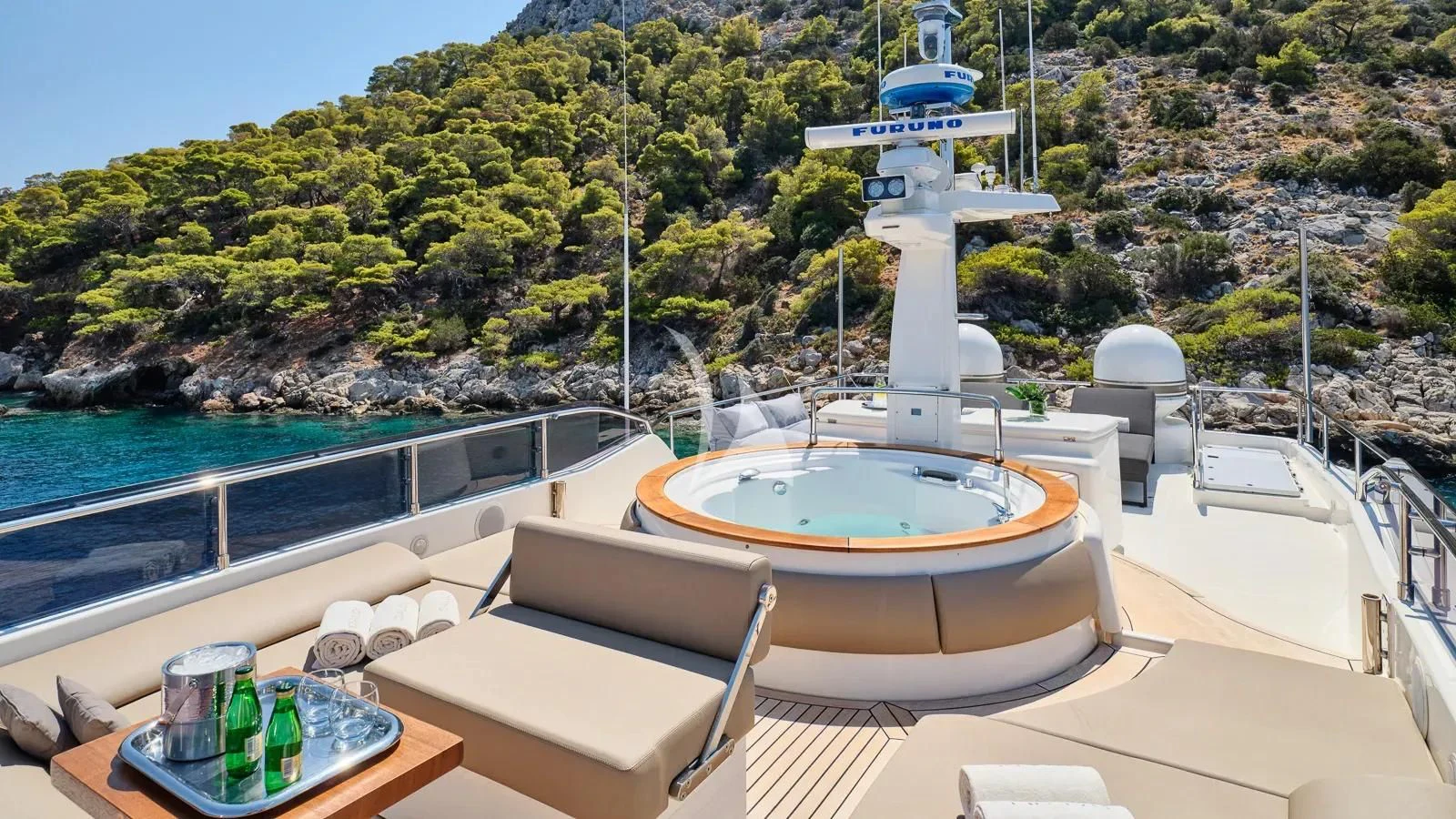a pool with a table and chairs aboard DALOLI Yacht for Charter