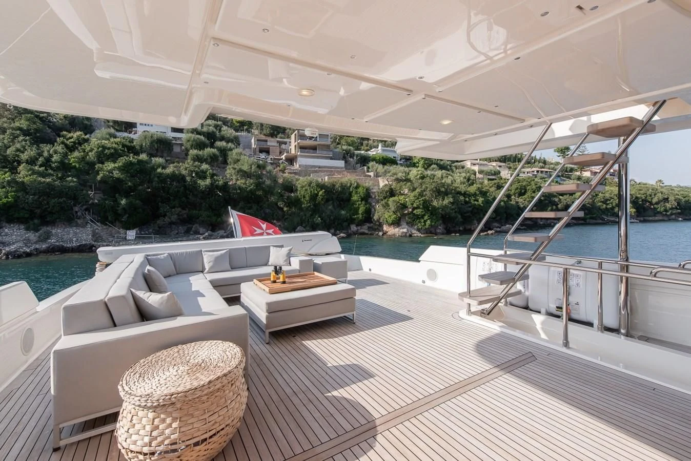 a large patio with a table and chairs on it aboard DALOLI Yacht for Charter