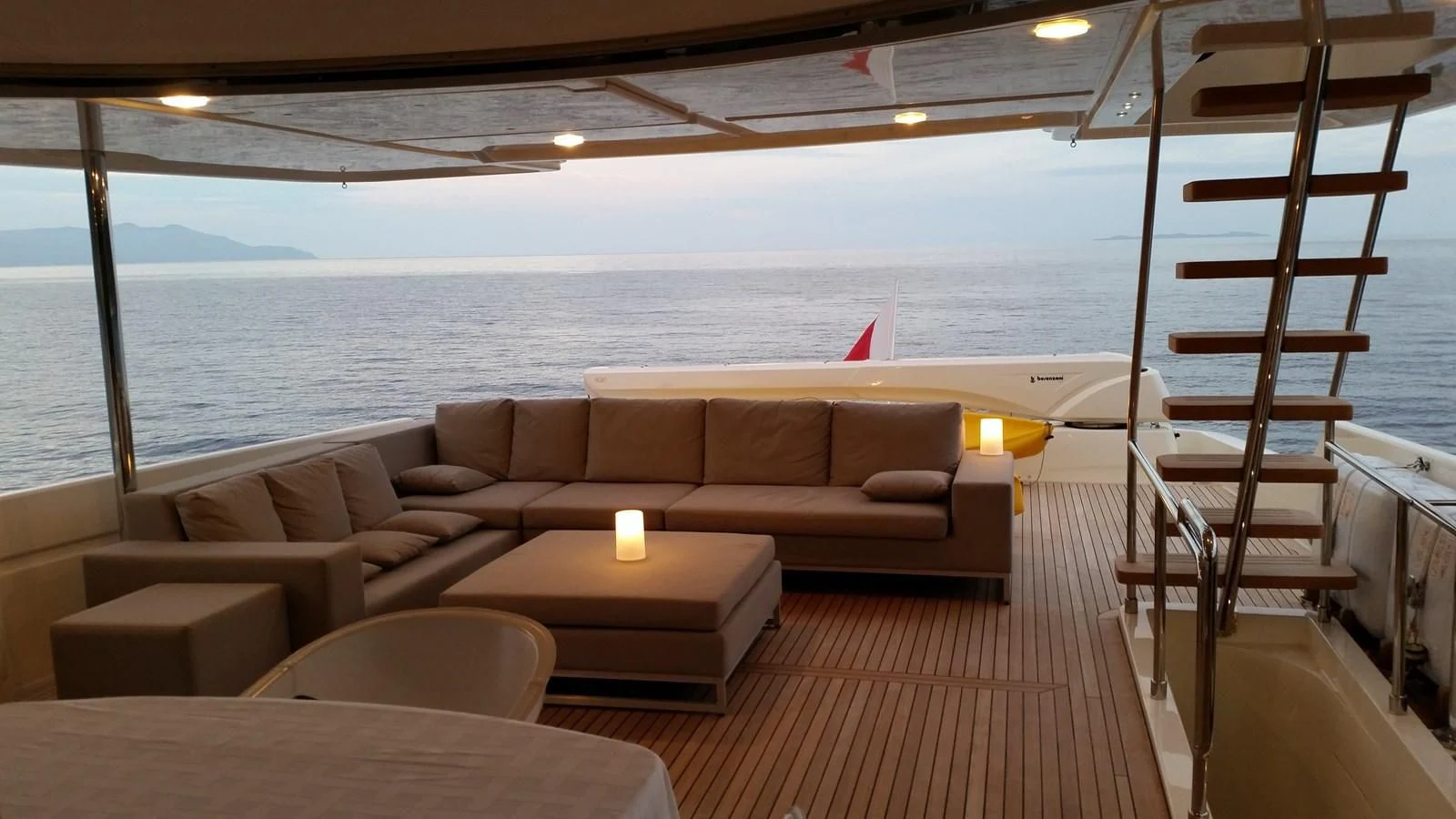 a living room with a couch and a table aboard DALOLI Yacht for Charter