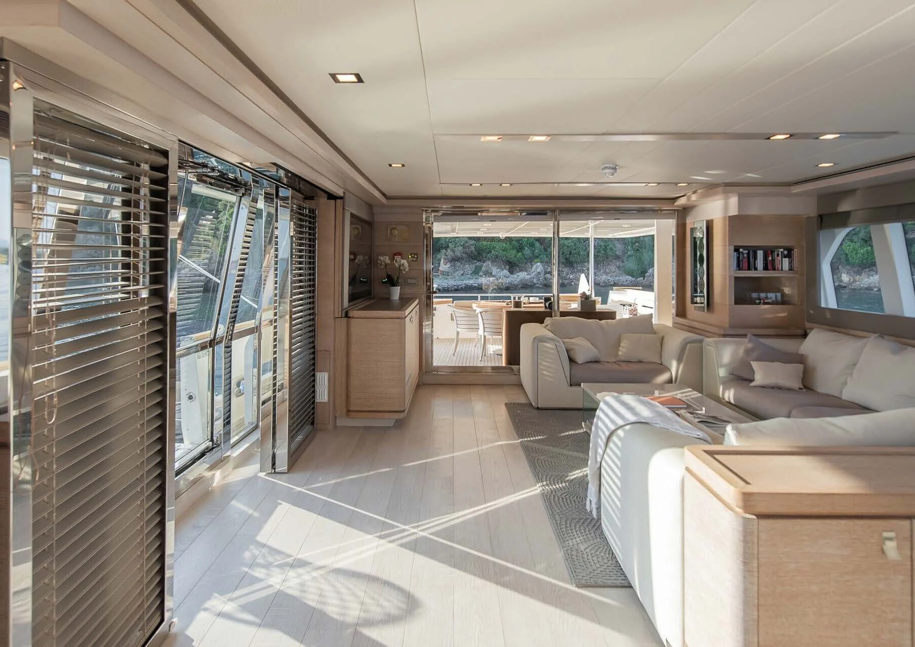 a living room with a glass wall aboard DALOLI Yacht for Charter