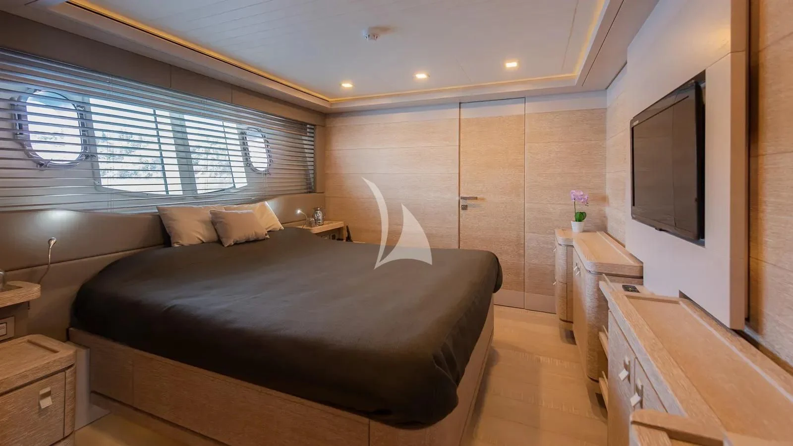a bedroom with a large bed aboard DALOLI Yacht for Charter
