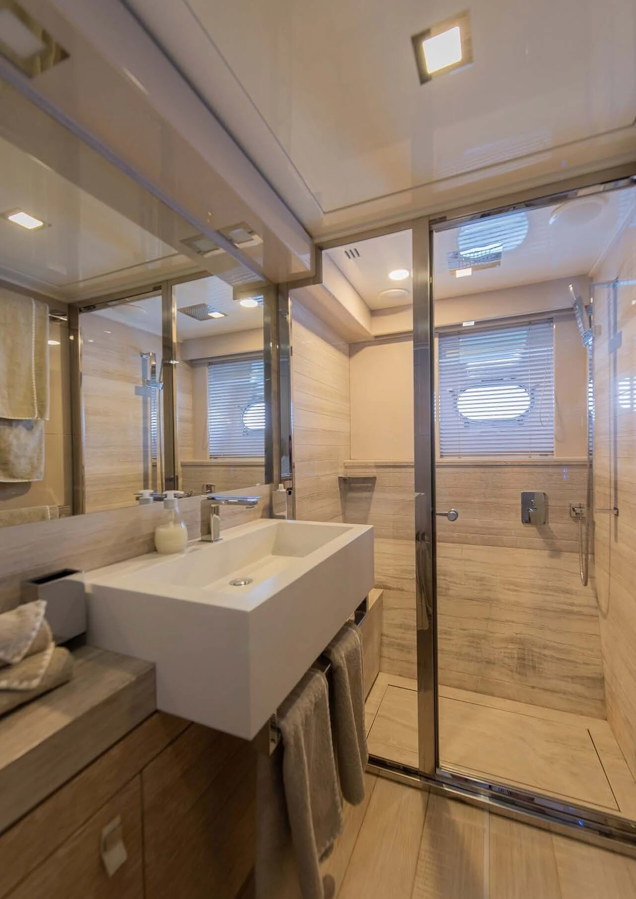 a bathroom with a glass shower aboard DALOLI Yacht for Charter