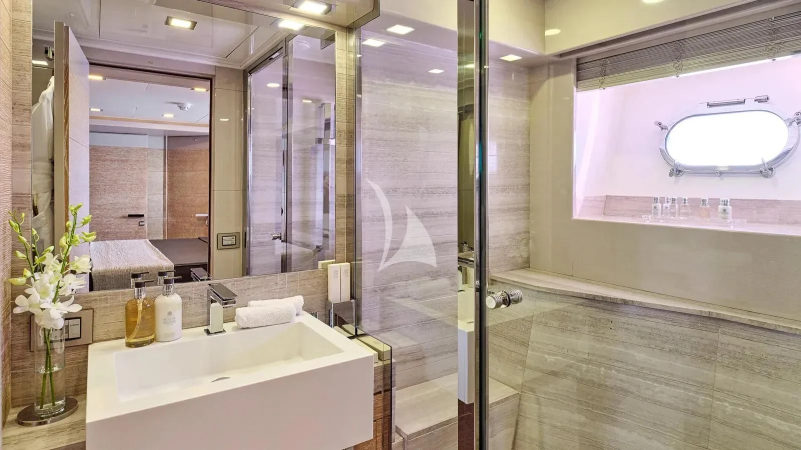 a bathroom with a large glass shower aboard DALOLI Yacht for Charter