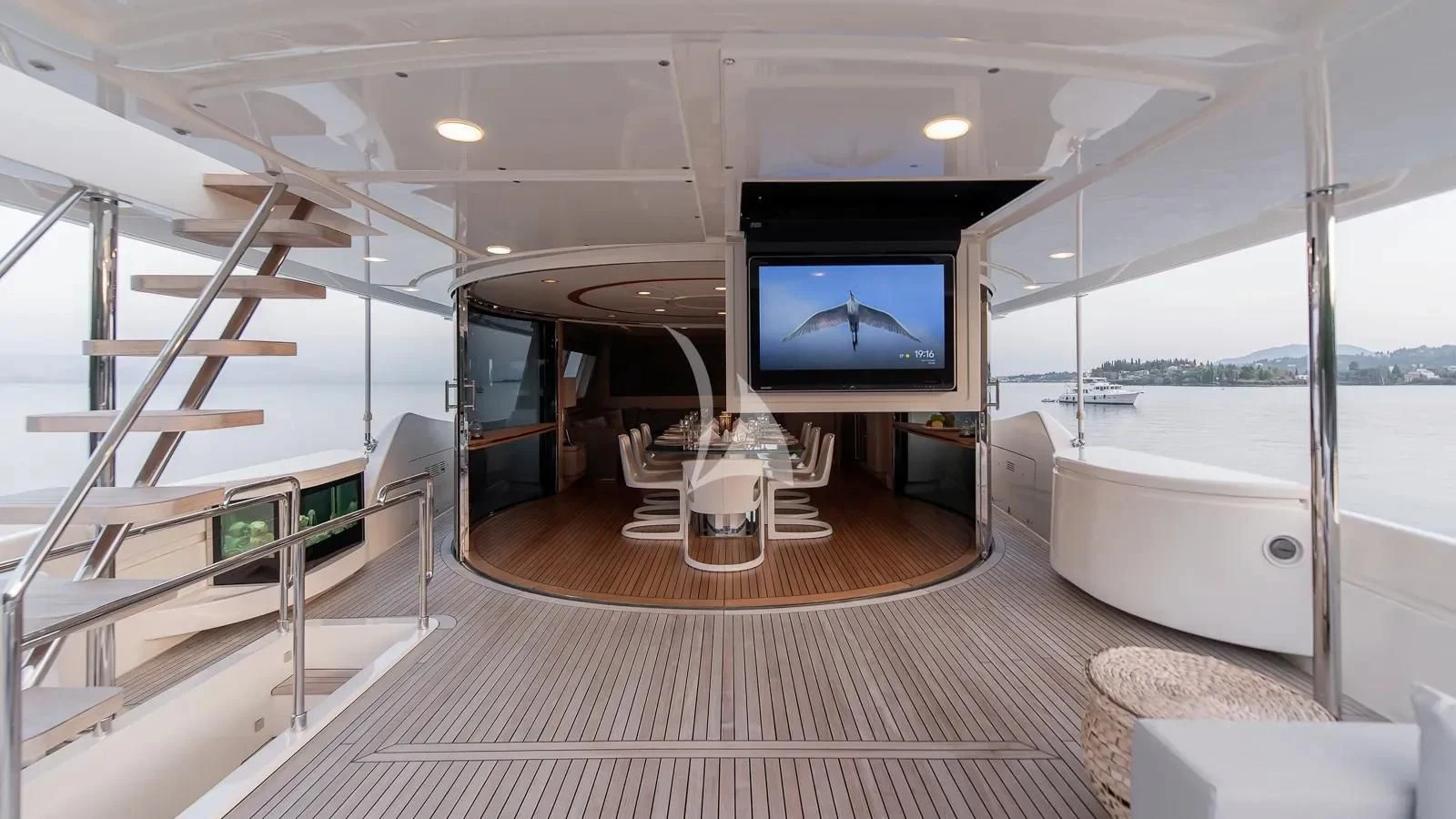 a room with a tv and a chair aboard DALOLI Yacht for Charter