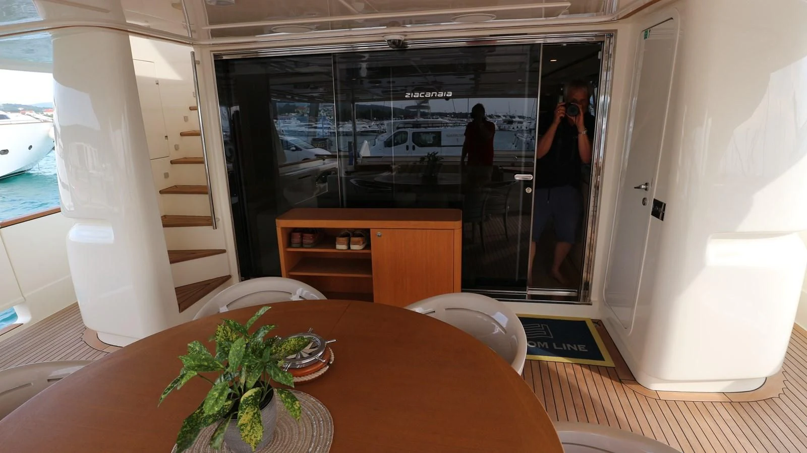 a room with a table and a mirror aboard DALOLI Yacht for Charter