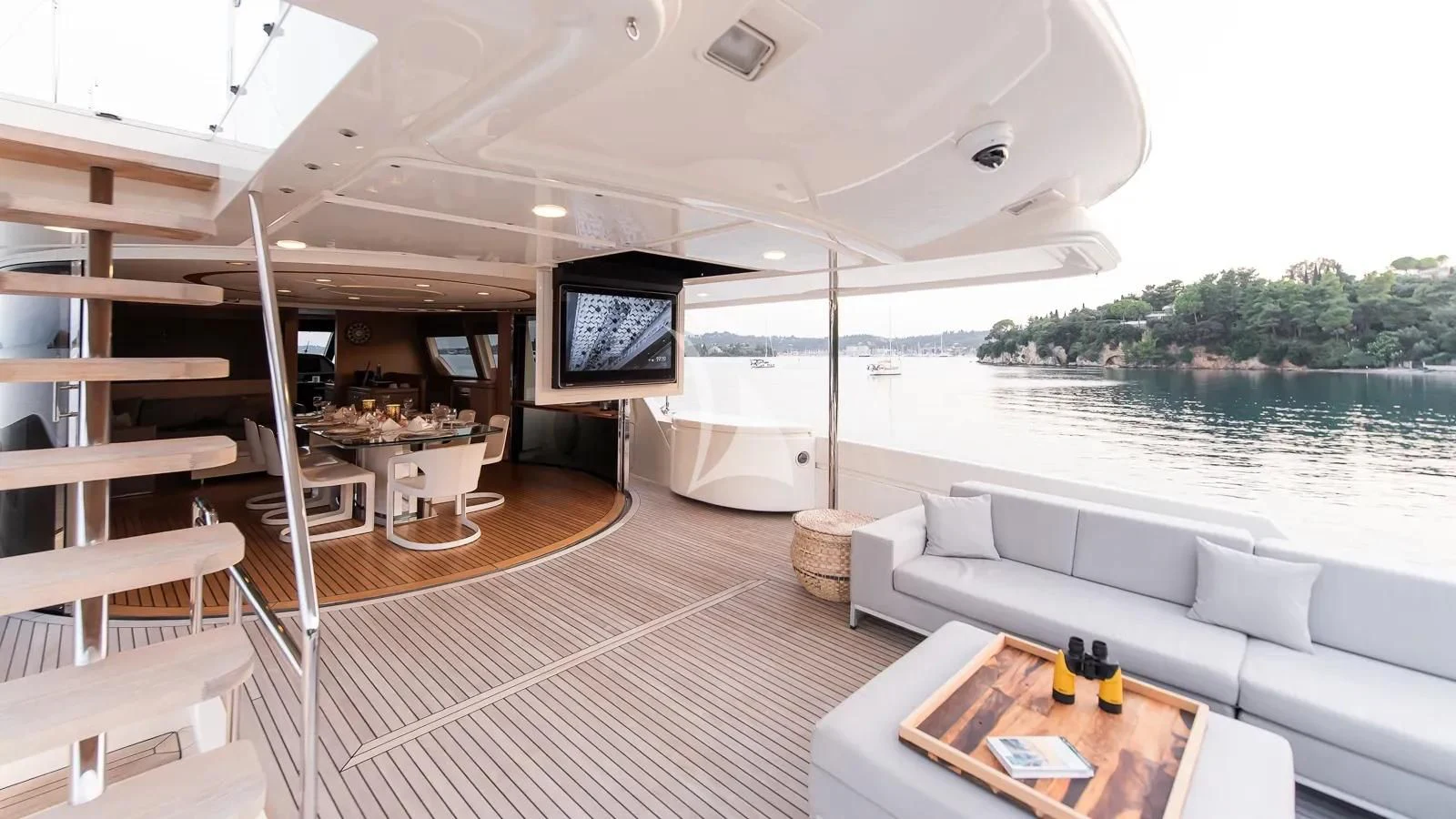 a large white tent with a couch and a television on it aboard DALOLI Yacht for Charter