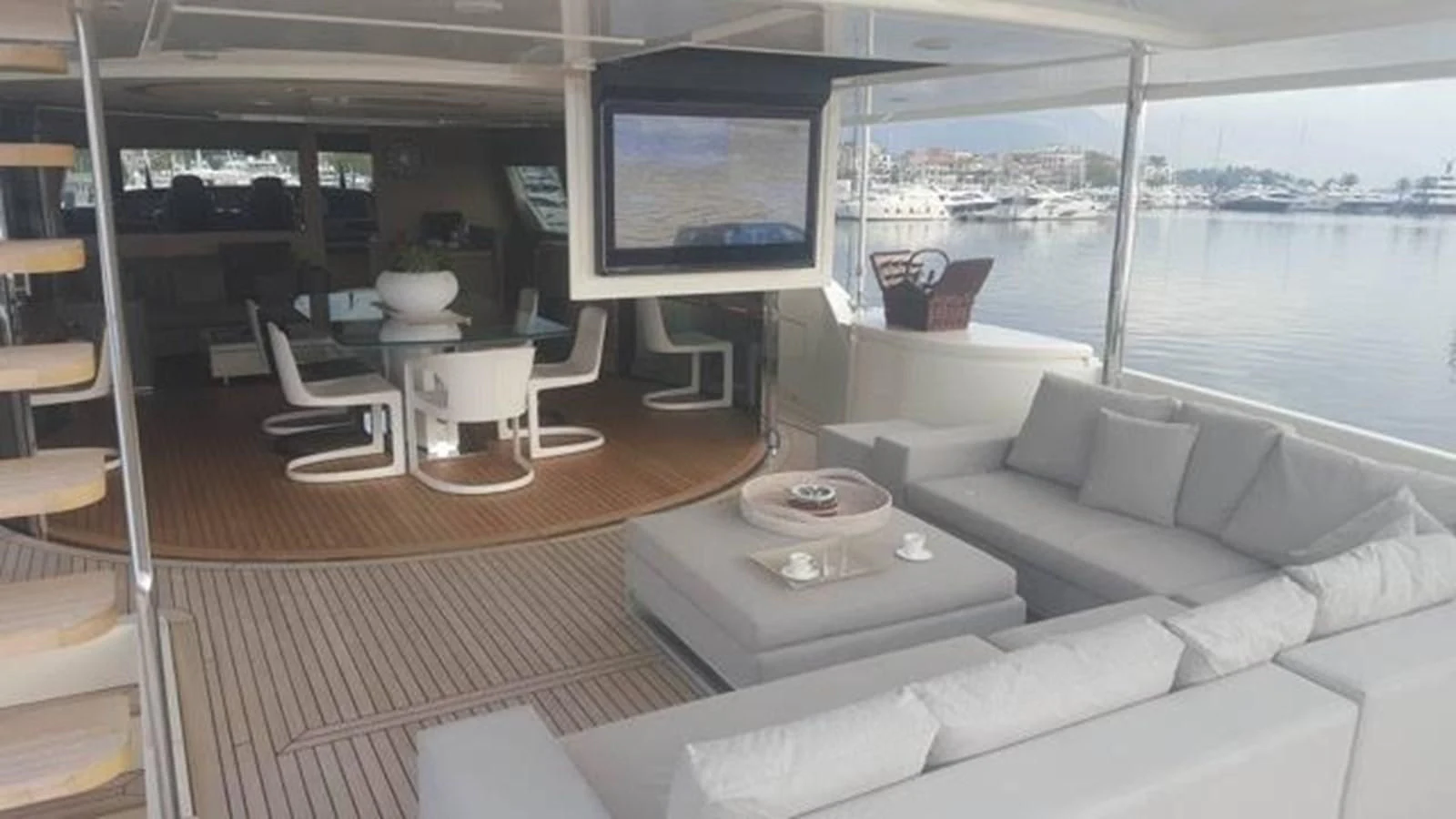 a room with a couch and a tv on the wall aboard DALOLI Yacht for Charter