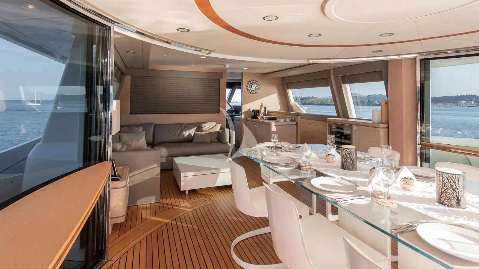 a living room with a large table and chairs aboard DALOLI Yacht for Charter