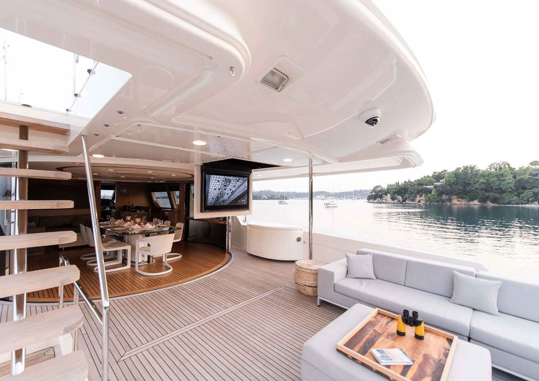 a living room with a large window aboard DALOLI Yacht for Charter