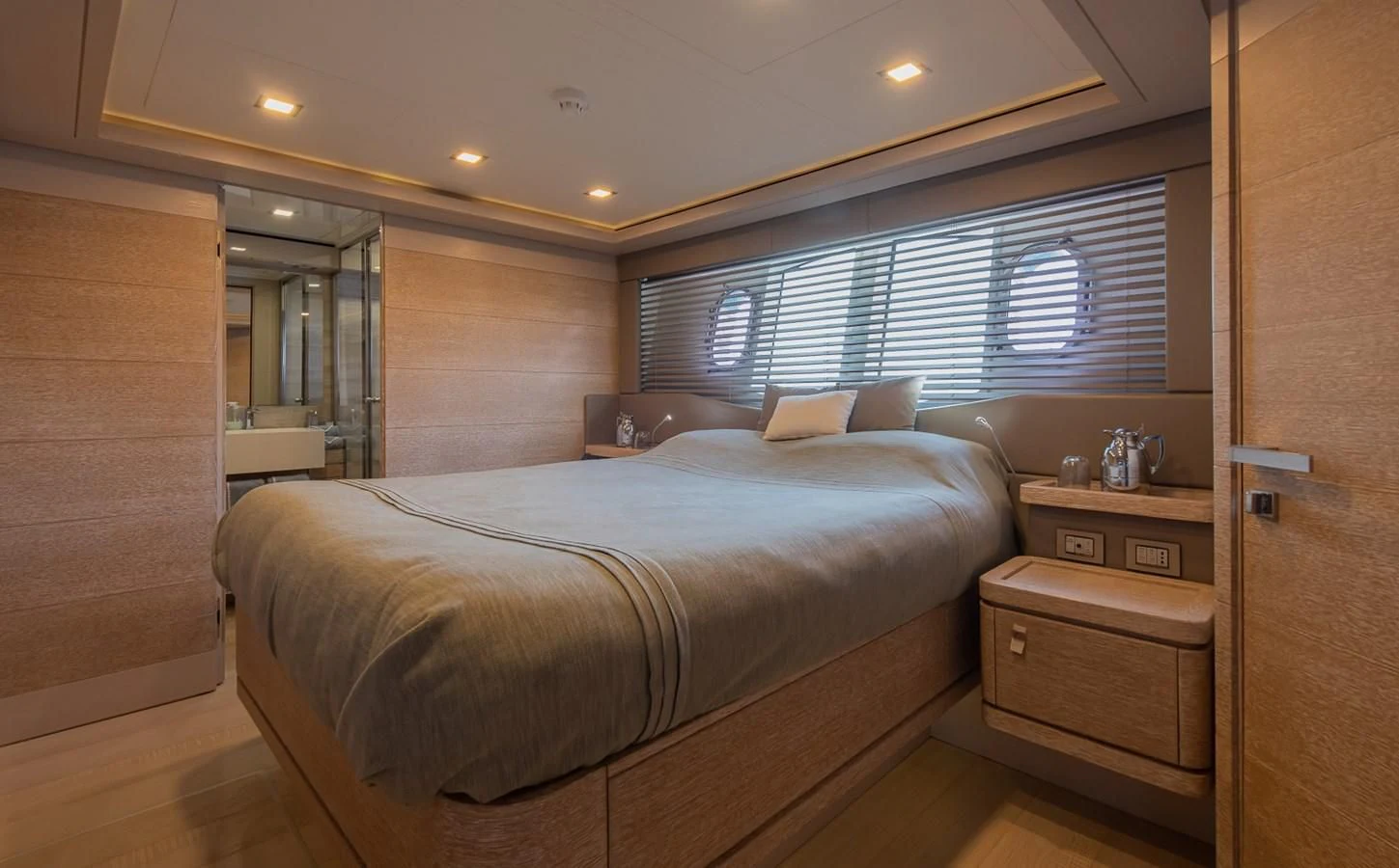 a bedroom with a bed and a mirror aboard DALOLI Yacht for Charter