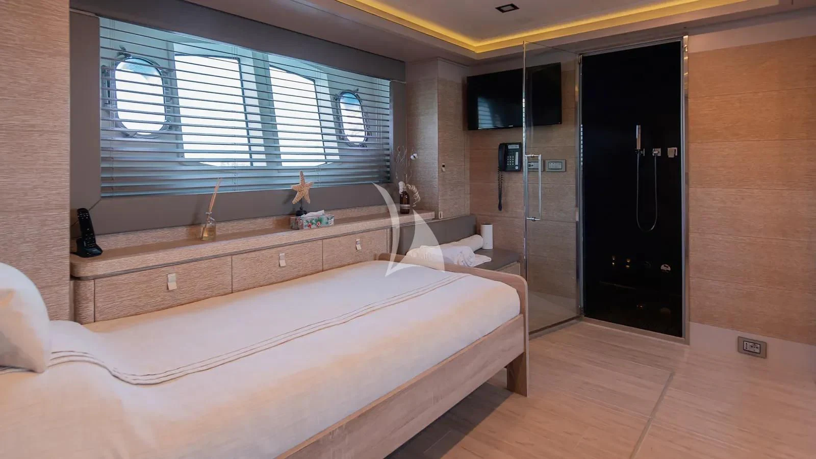 a room with a bed and a window aboard DALOLI Yacht for Charter