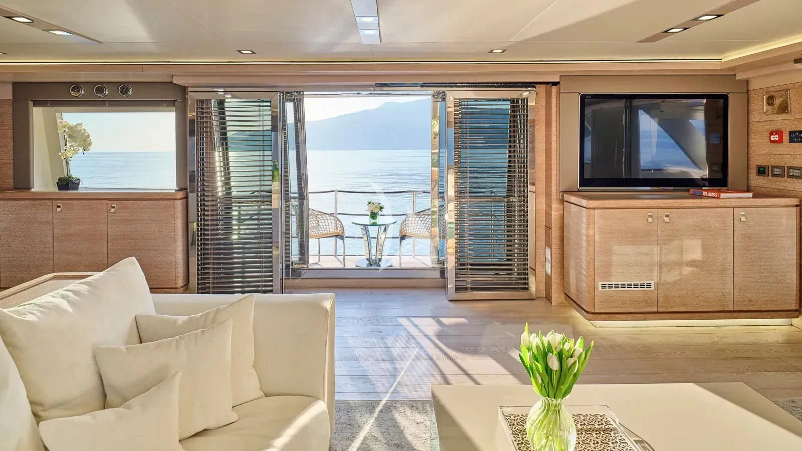 a living room with a large tv aboard DALOLI Yacht for Charter