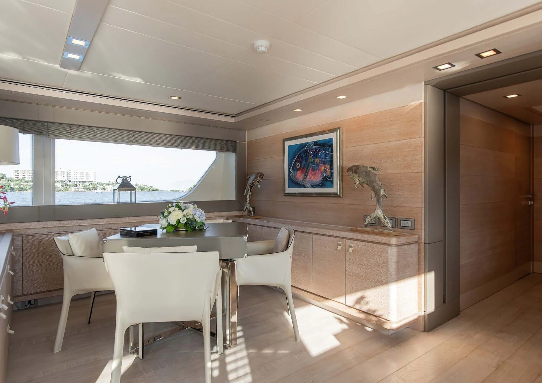 a large kitchen with a table and chairs aboard DALOLI Yacht for Charter