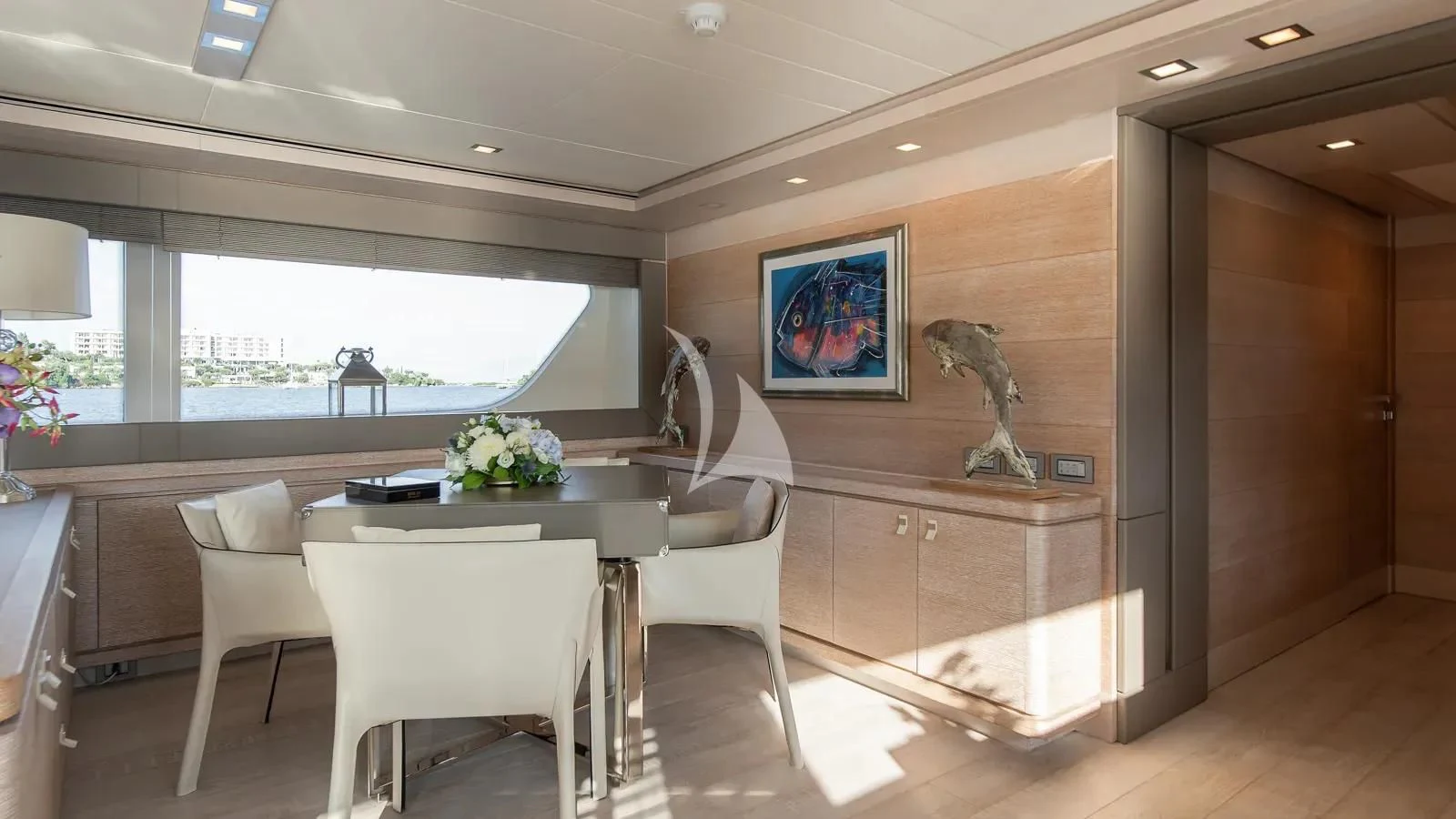 a kitchen with a table and chairs aboard DALOLI Yacht for Charter