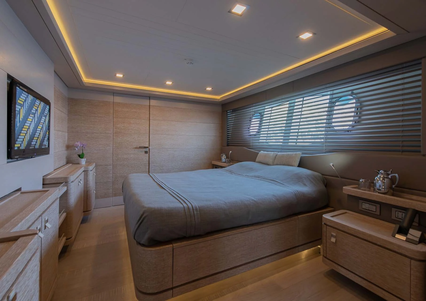 a room with a bed and a tv aboard DALOLI Yacht for Charter