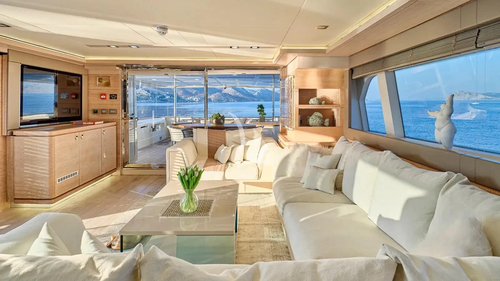 a living room with a large window aboard DALOLI Yacht for Charter