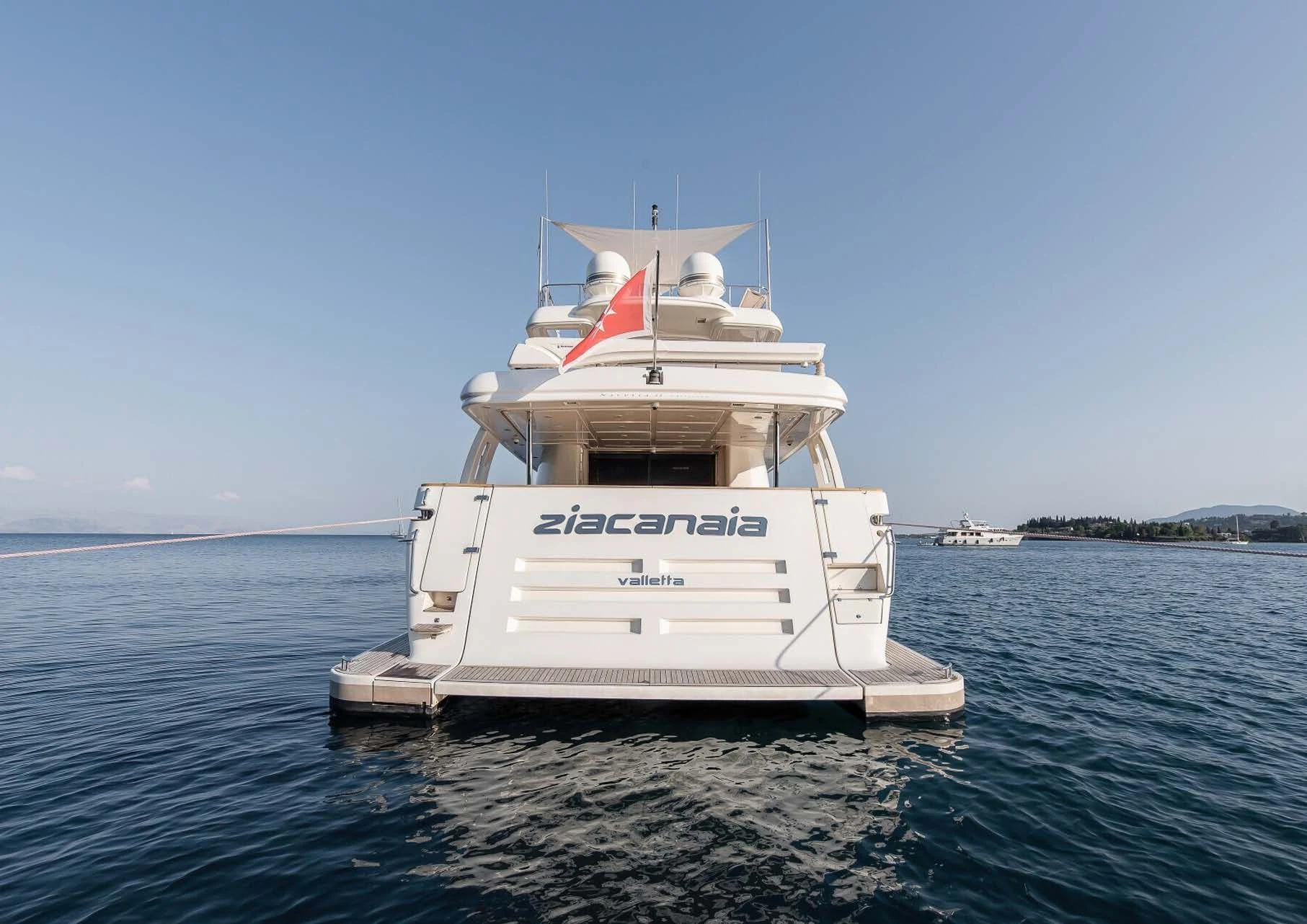 a white boat in the water aboard DALOLI Yacht for Charter