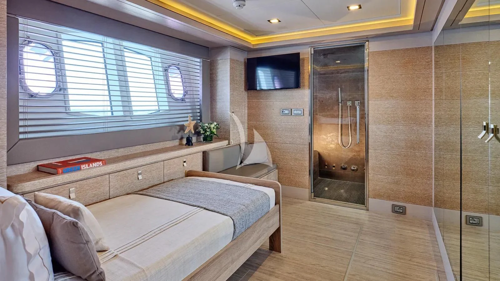 a room with a bed and a window aboard DALOLI Yacht for Charter