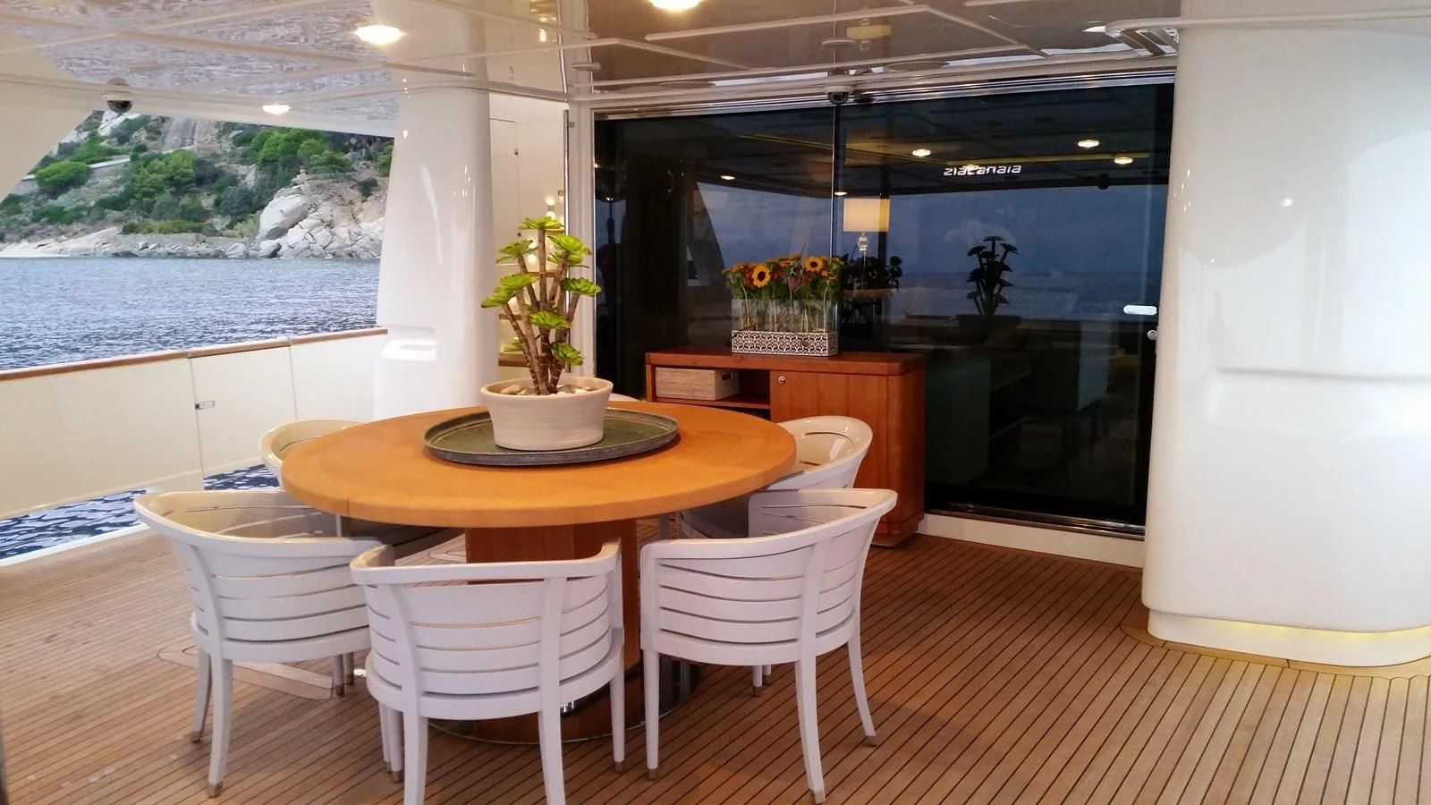 a room with tables and chairs aboard DALOLI Yacht for Charter