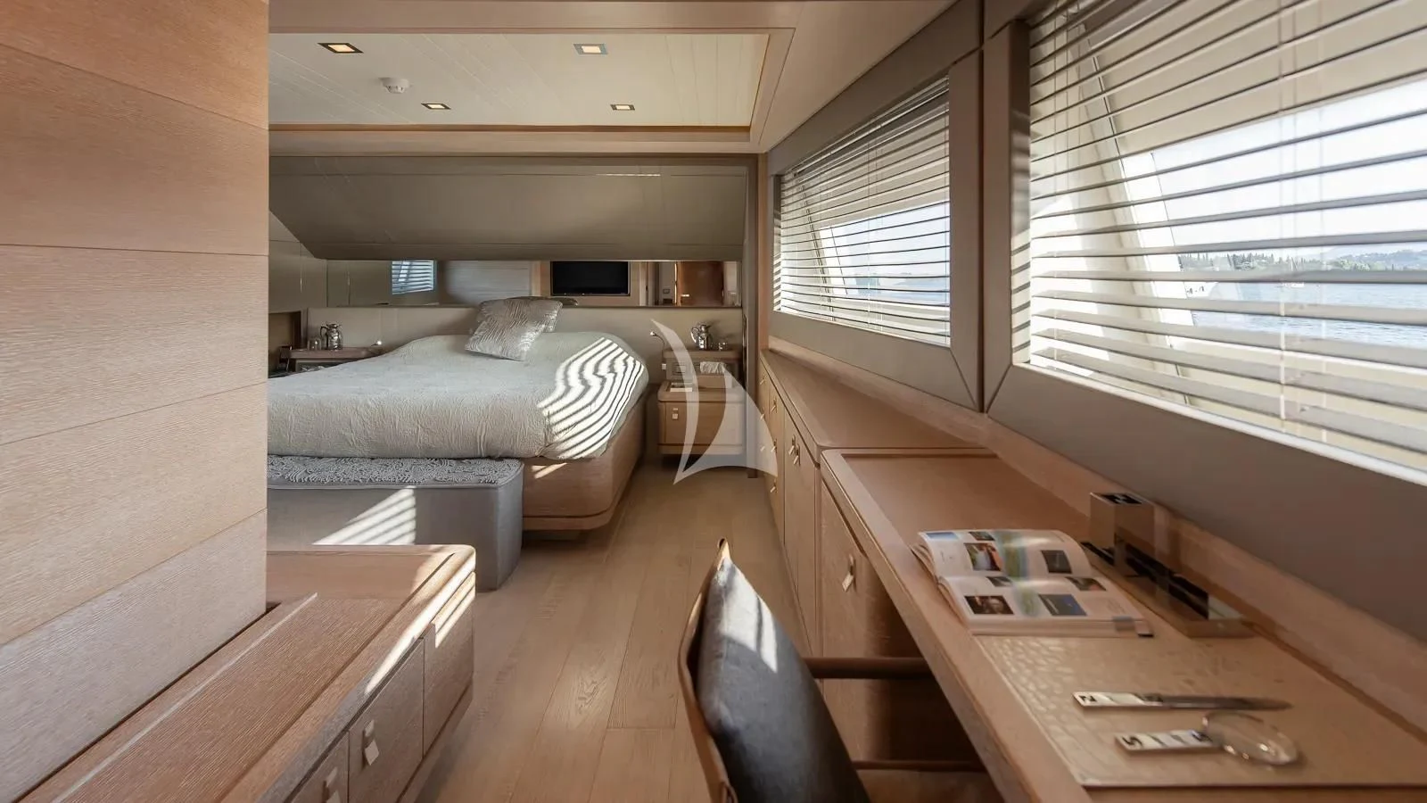 a room with a bed and a desk aboard DALOLI Yacht for Charter