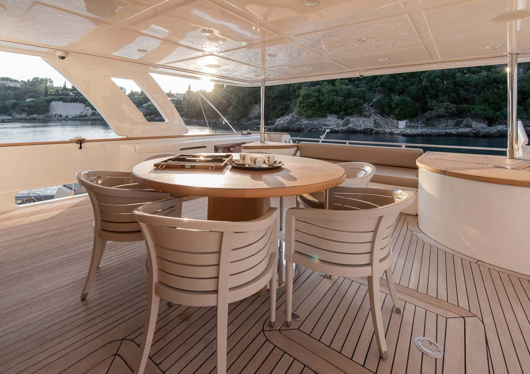 a table and chairs on a deck aboard DALOLI Yacht for Charter
