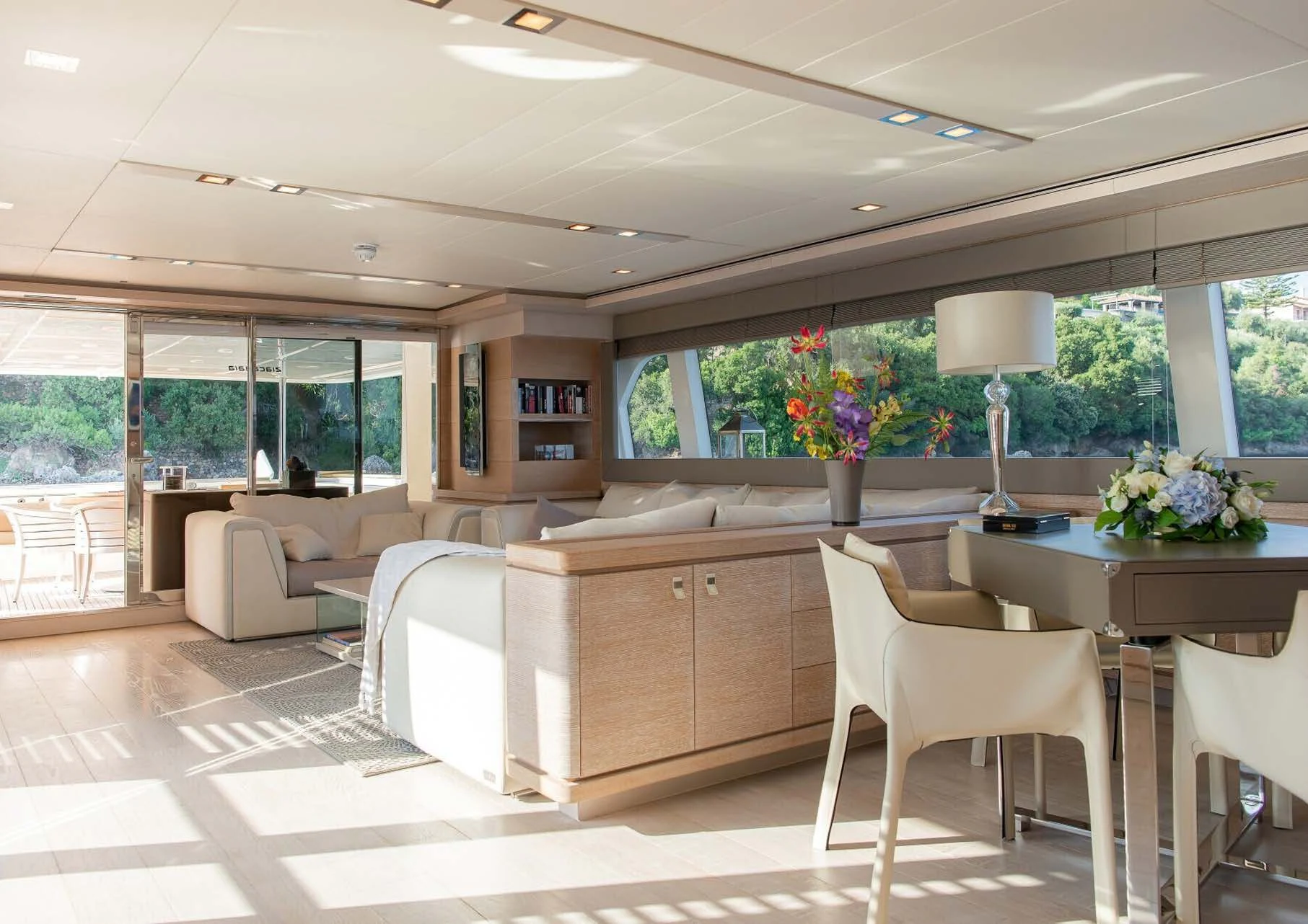 a large room with a table and chairs aboard DALOLI Yacht for Charter