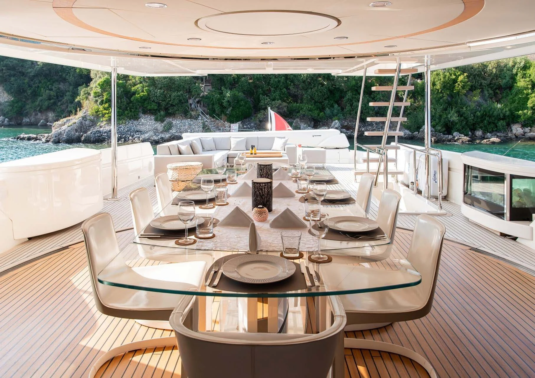 a table set for a dinner aboard DALOLI Yacht for Charter