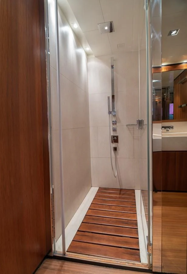 a bathroom with a wood floor aboard TIN TIN Yacht for Sale