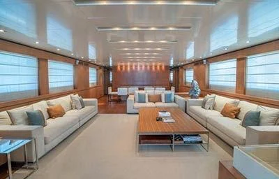 a living room with a couch and a table aboard TIN TIN Yacht for Sale