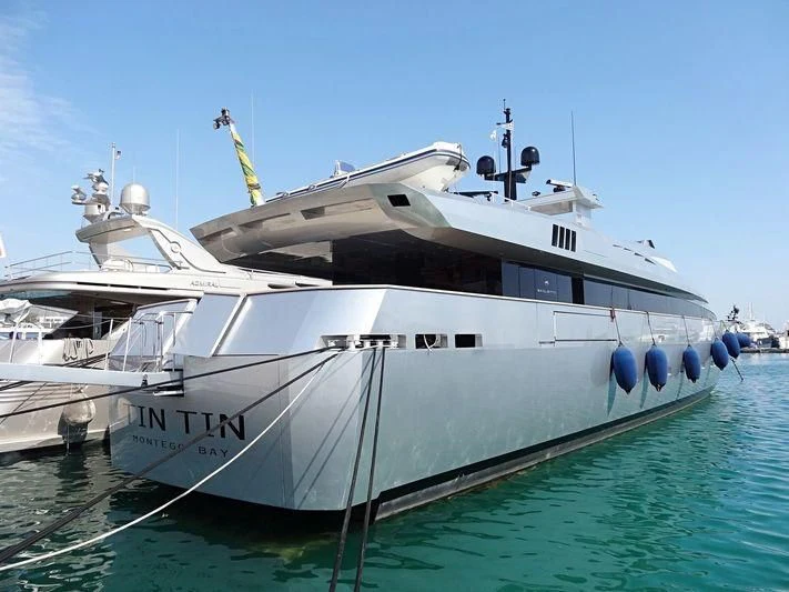 a white boat in the water aboard TIN TIN Yacht for Sale