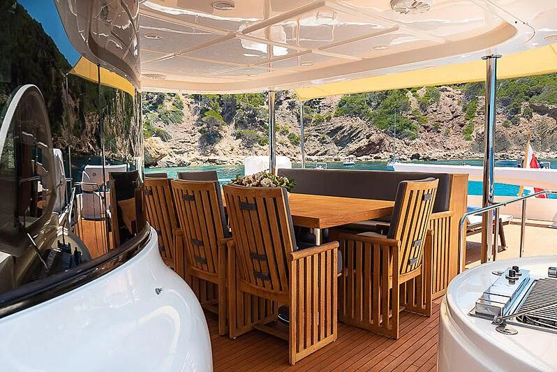 a room with a table and chairs aboard BLUE LINE Yacht for Sale