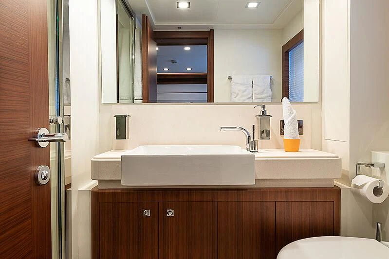 a bathroom with a sink and a mirror aboard BLUE LINE Yacht for Sale