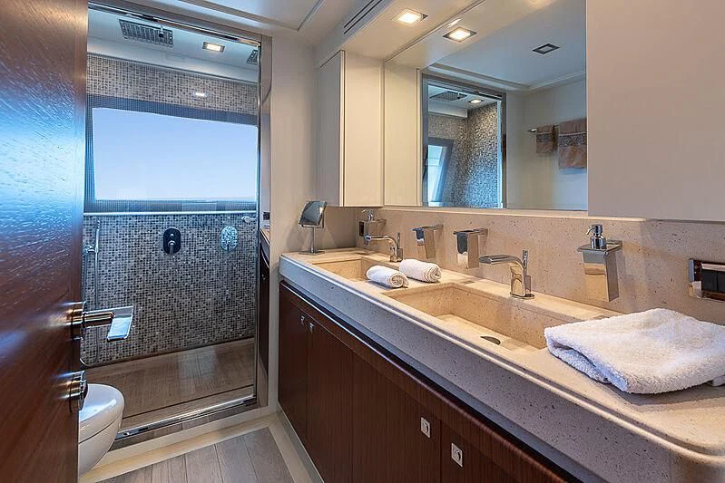 a bathroom with a large mirror aboard BLUE LINE Yacht for Sale