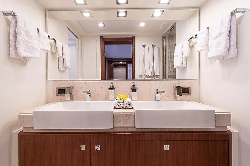 a bathroom with a large mirror aboard BLUE LINE Yacht for Sale